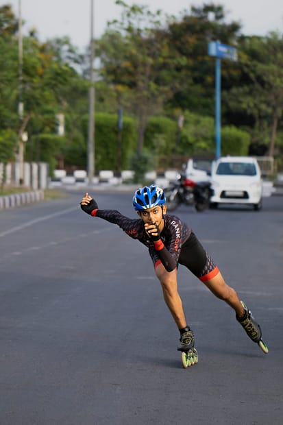 a man riding a skateboard down a street