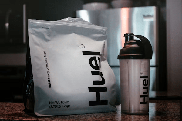 "Various protein powder containers, showcasing different brands and flavors for fitness enthusiasts."